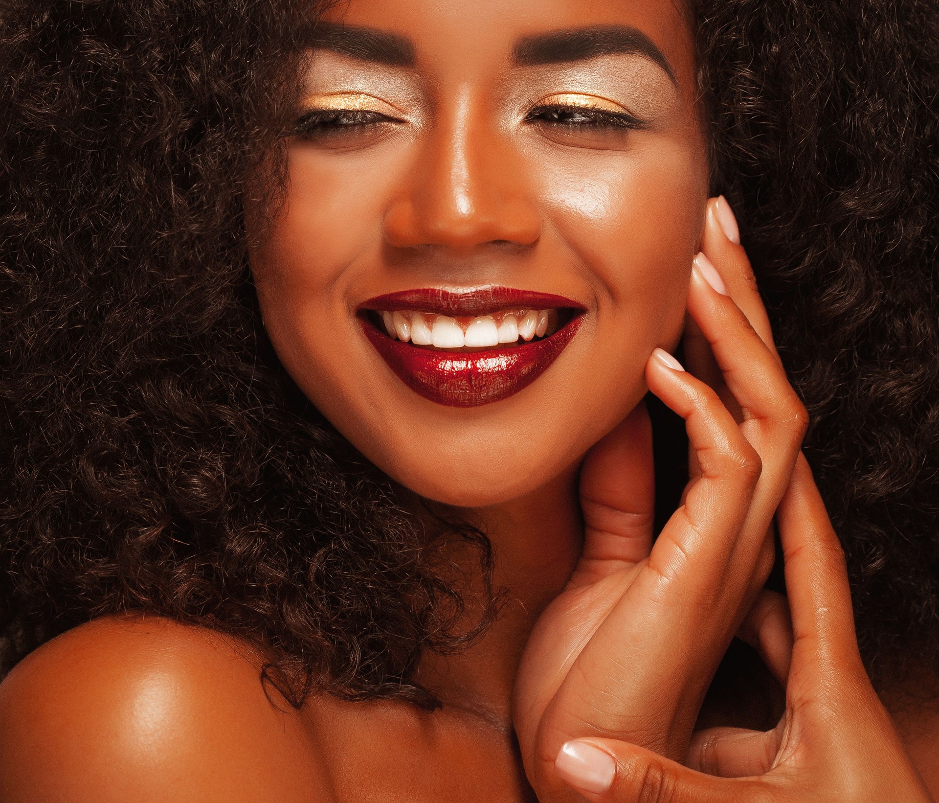 Close up portrait of beautiful young black woman laughing